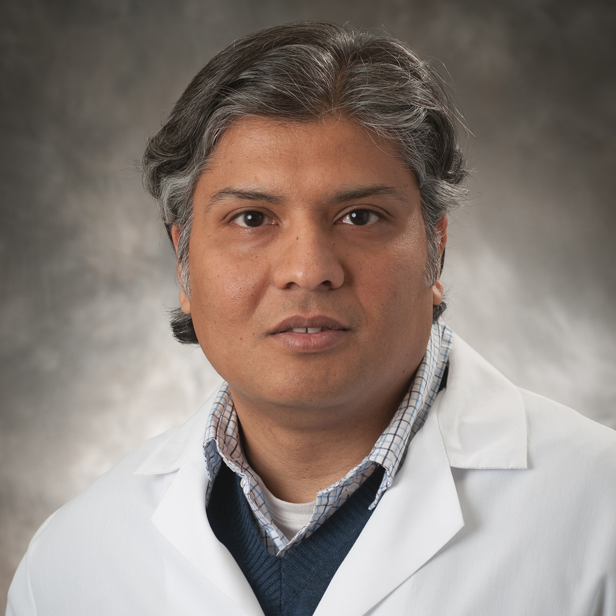 A friendly headshot of Abdul Syed, MD