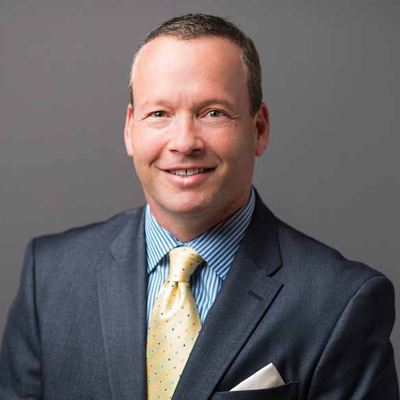 Smiling headshot of Eli Finkelstein, MD