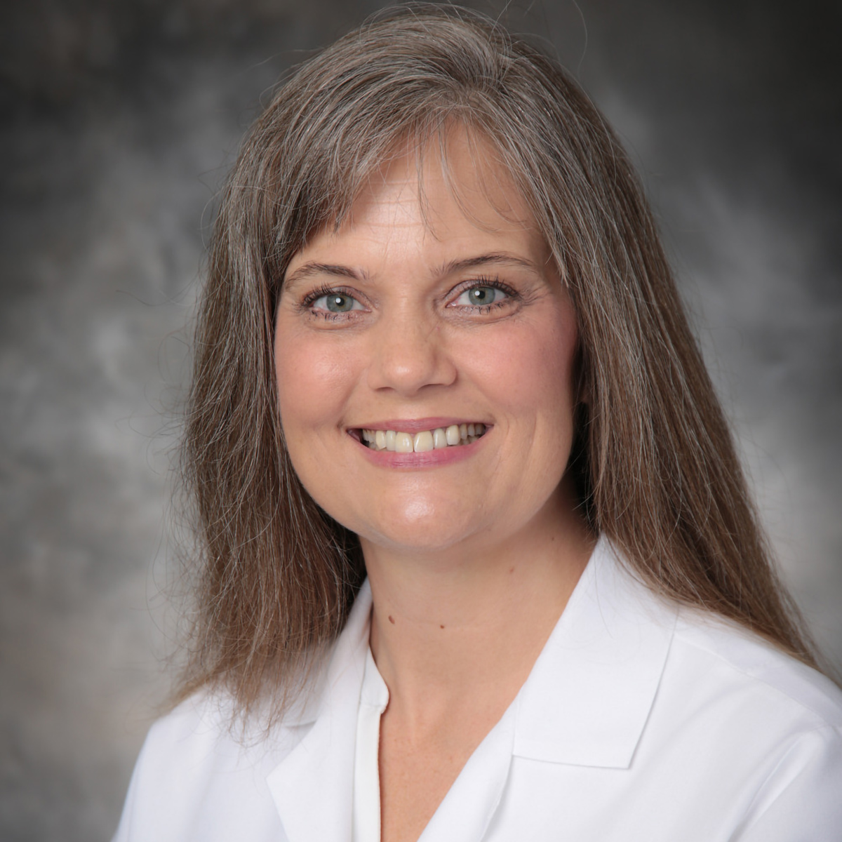 A friendly headshot of Janet Boone, MD