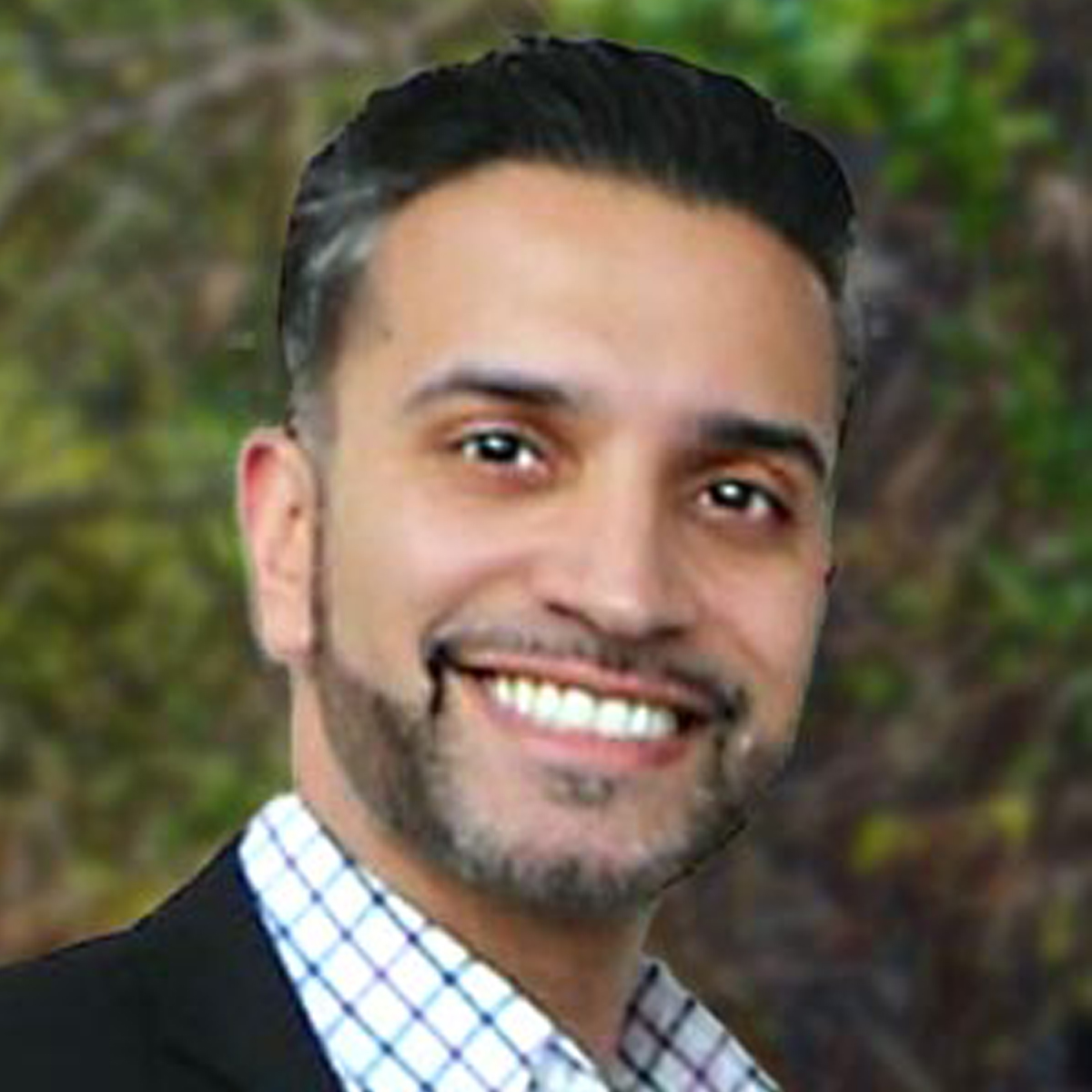 A friendly headshot of Omar Tanvir Khan, MD