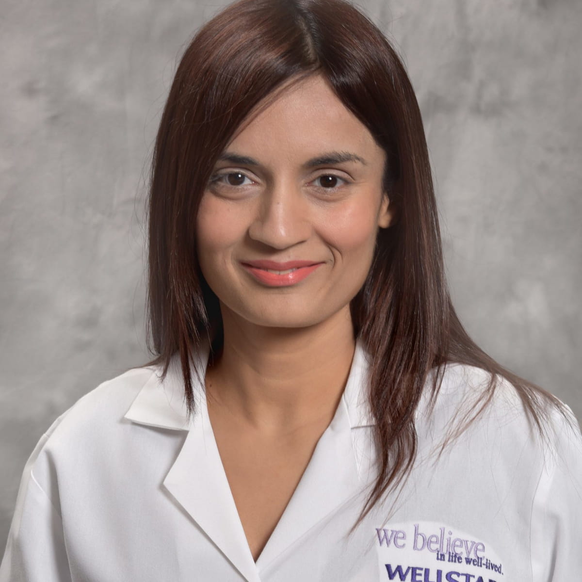 A friendly headshot of Sana Muneer, MD